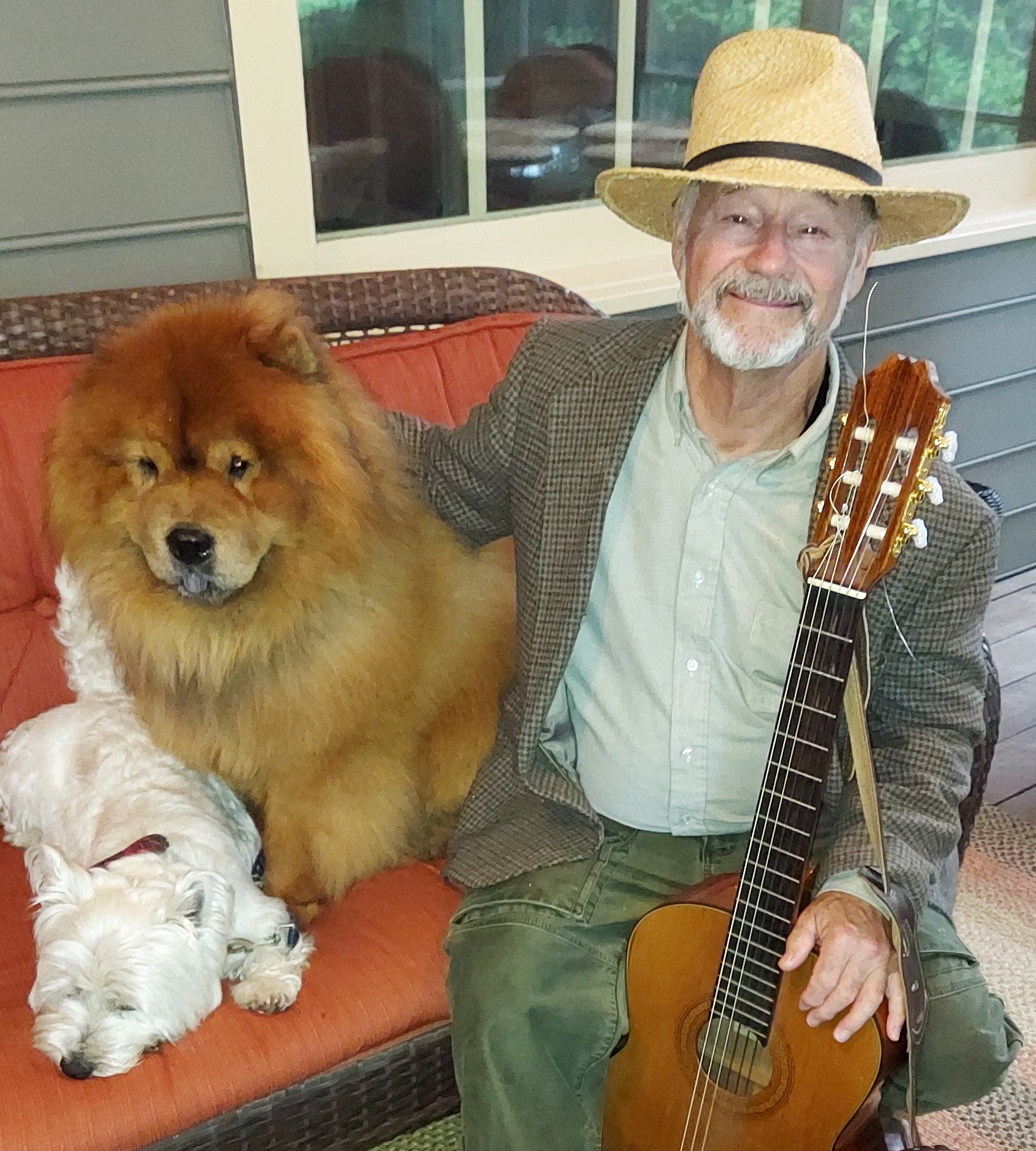 Kent LaRue VSA-certified dog trainer Kent LaRue with his two dogs and guitar