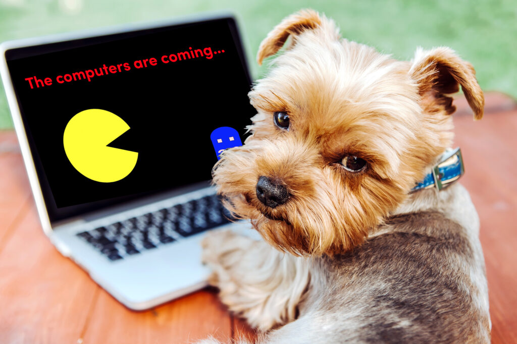 the computers are coming (dog looking away from computer with pacman) What does the future of dog training look like in a world dominated by AI?